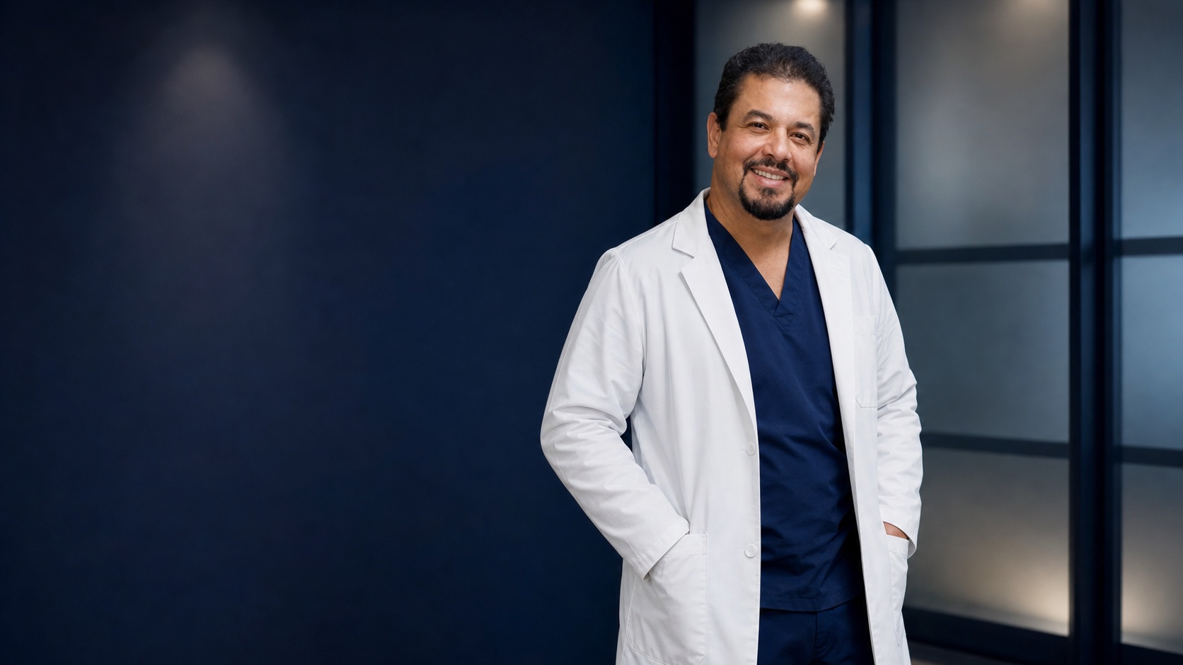 Dr. Hector Roldan in a professional clinical portrait